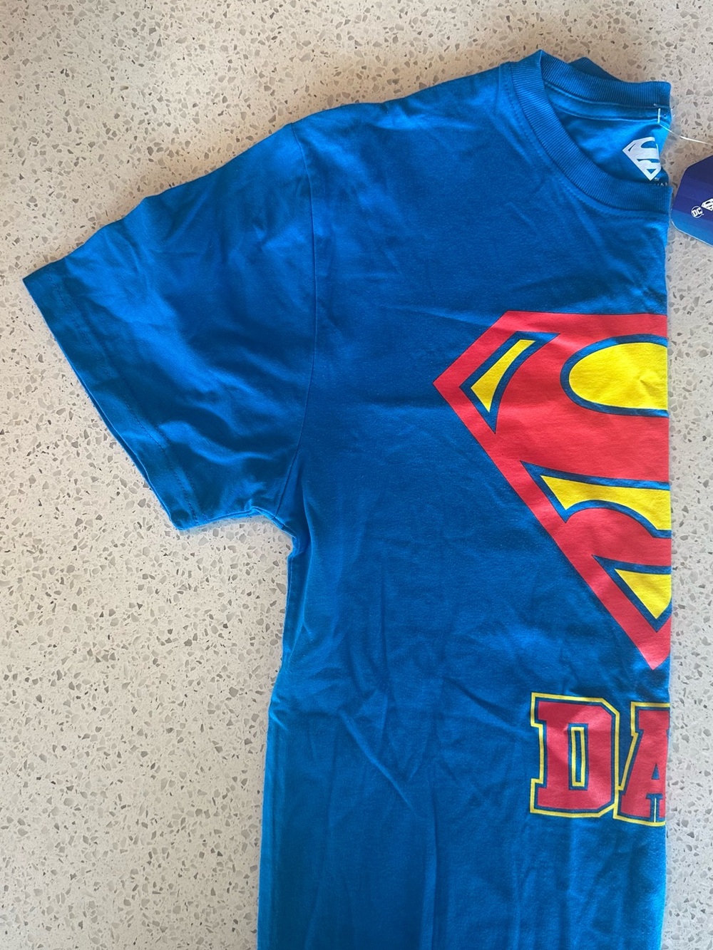 DC Comics Blue Superman Logo Short Sleeve Tee with Red and Yellow Graphic